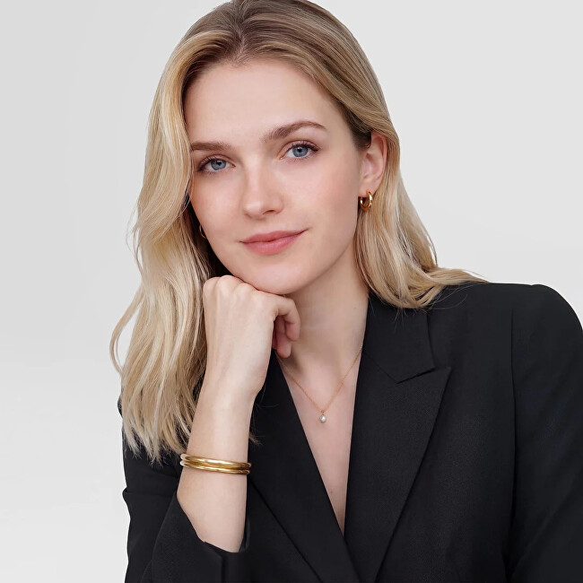 Daniel Wellington Pevný otevřený náramek z pozlacené oceli Arch DW0040194